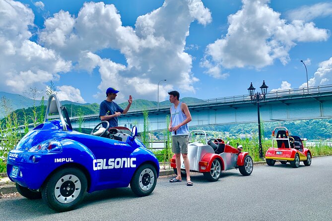 Cute & Fun E-Car Tour Following Guide Around Lake Kawaguchiko - Learning About Local History and Culture